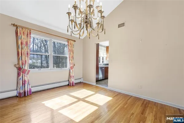 a view of a kitchen with a sink and a window