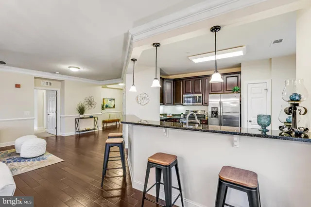 a kitchen with a stove and wooden cabinets