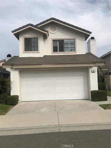 a front view of a house with garage
