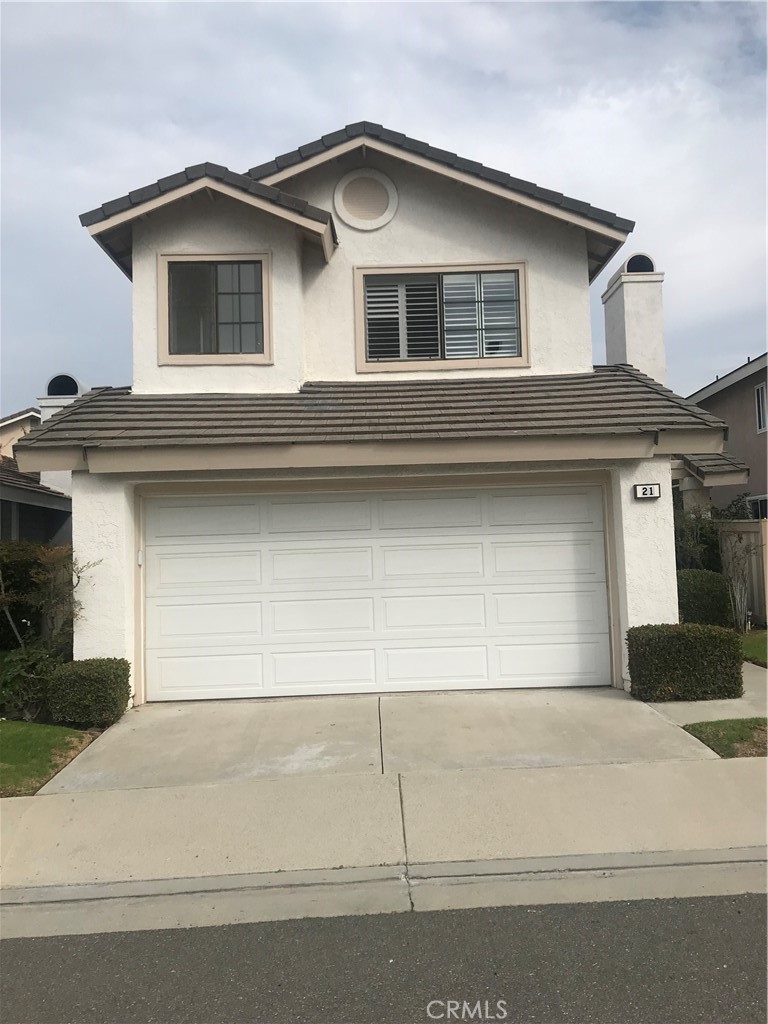 21 Silkberry Irvine, CA 92614 - Photo 1 of 18 a front view of a house with garage
