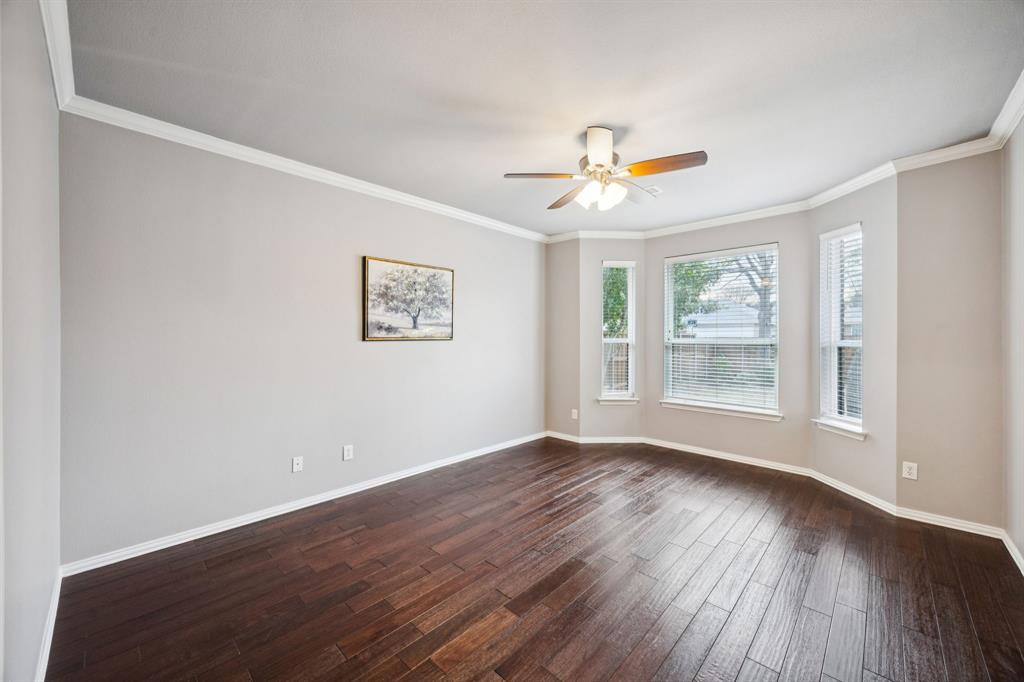 1516 High Country Lane Allen, TX 75002 - Photo 16 of 33 a view of an empty room with window and wooden floor