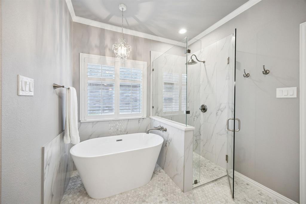 1516 High Country Lane Allen, TX 75002 - Photo 20 of 33 a bathroom with a bathtub and shower