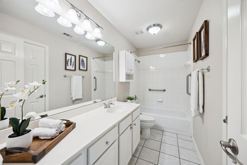 1516 High Country Lane Allen, TX 75002 - Photo 24 of 33 a bathroom with a double vanity sink mirror and toilet