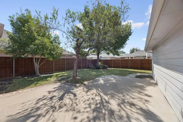 a view of backyard with green space