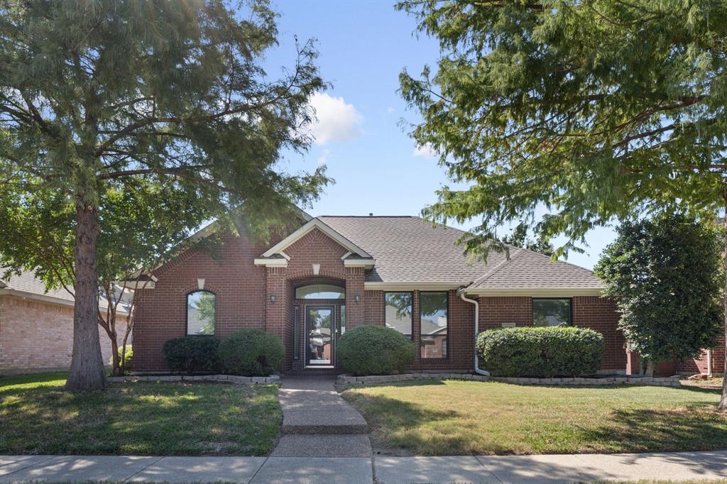 1516 High Country Lane Allen, TX 75002 - Photo 3 of 33 a front view of a house with a yard and garage