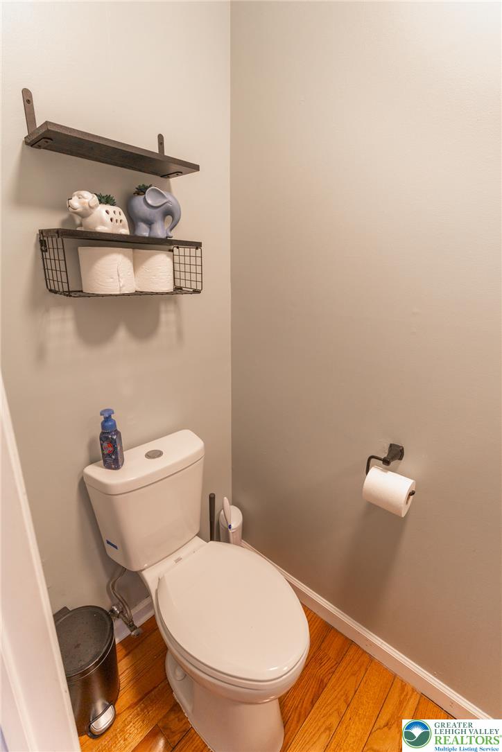 896 Briarstone Road Bethlehem, PA 18017 - Photo 9 of 26 a white toilet sitting next to a bathroom sink and vanity