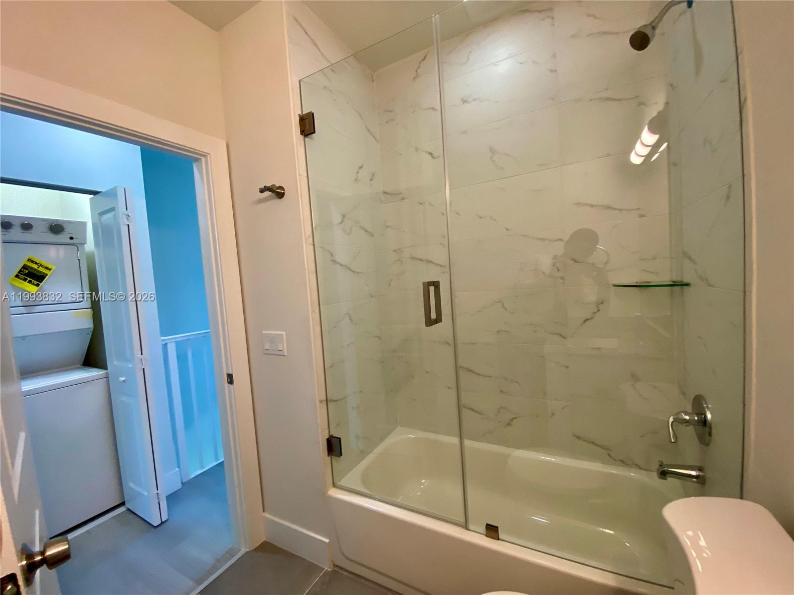 5860 Lincoln Street, Unit 5860 Hollywood, FL 33021 - Photo 14 of 21 a bathroom with a bathtub and a shower