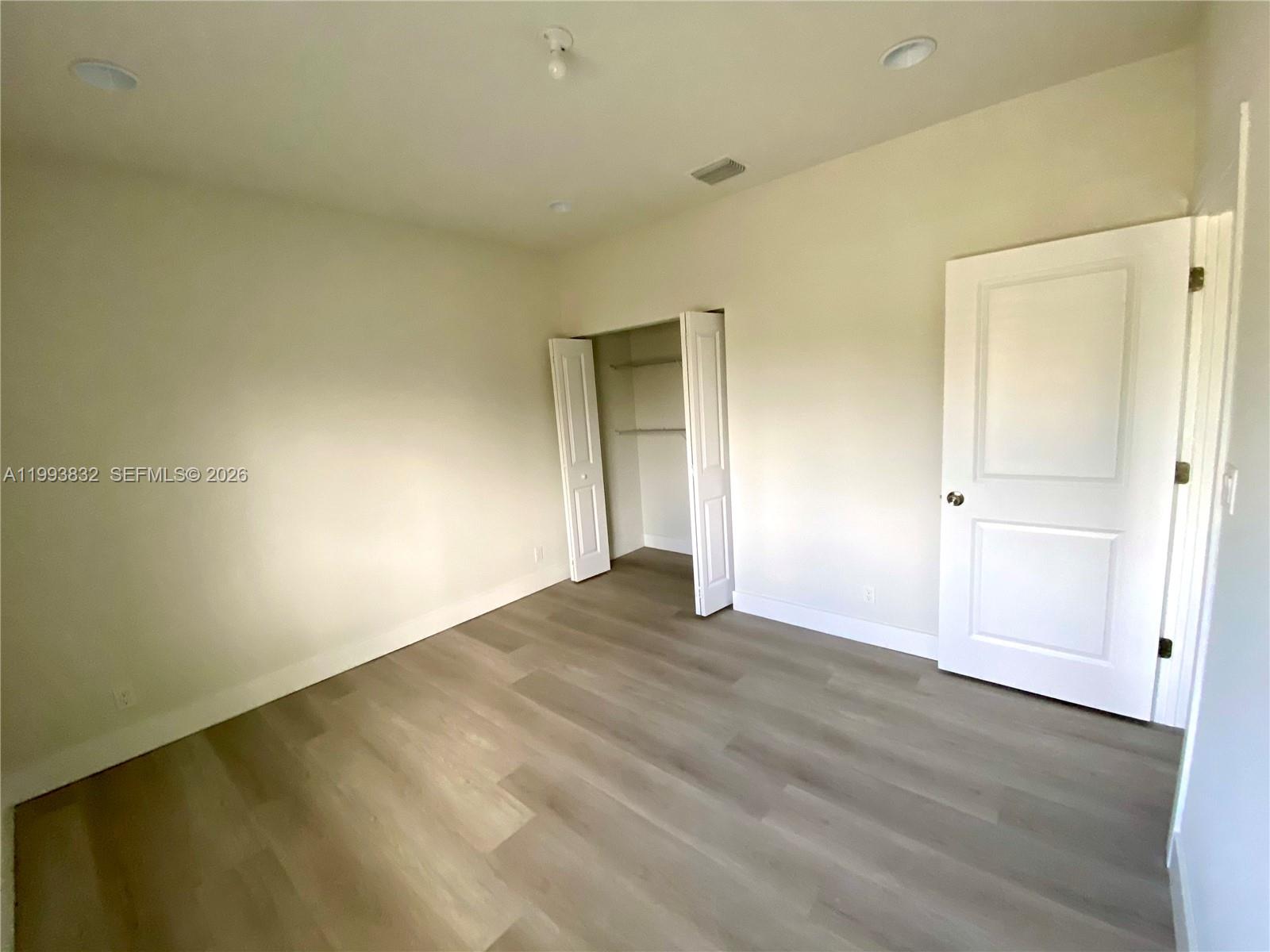 5860 Lincoln Street, Unit 5860 Hollywood, FL 33021 - Photo 15 of 21 wooden floor in an empty room