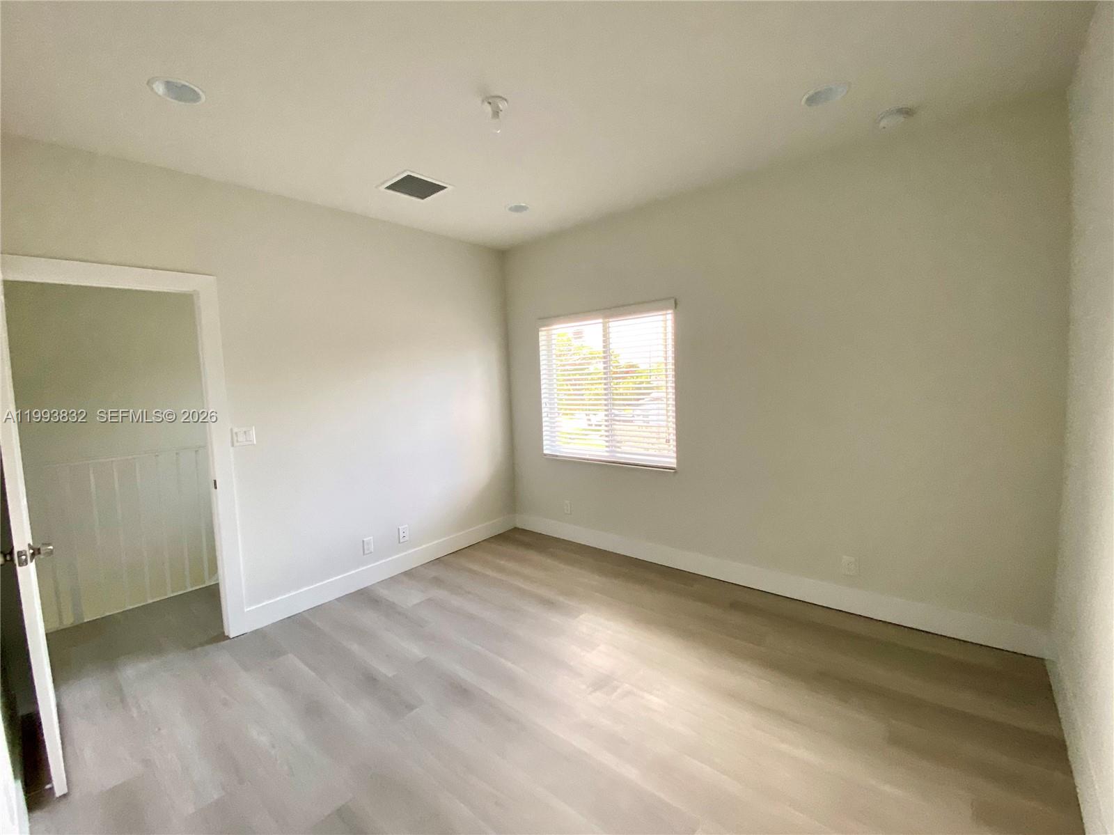5860 Lincoln Street, Unit 5860 Hollywood, FL 33021 - Photo 16 of 21 an empty room with windows