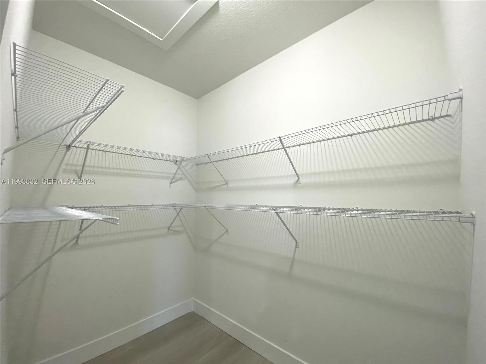 5860 Lincoln Street, Unit 5860 Hollywood, FL 33021 - Photo 18 of 21 a view of a room with racks on the wall