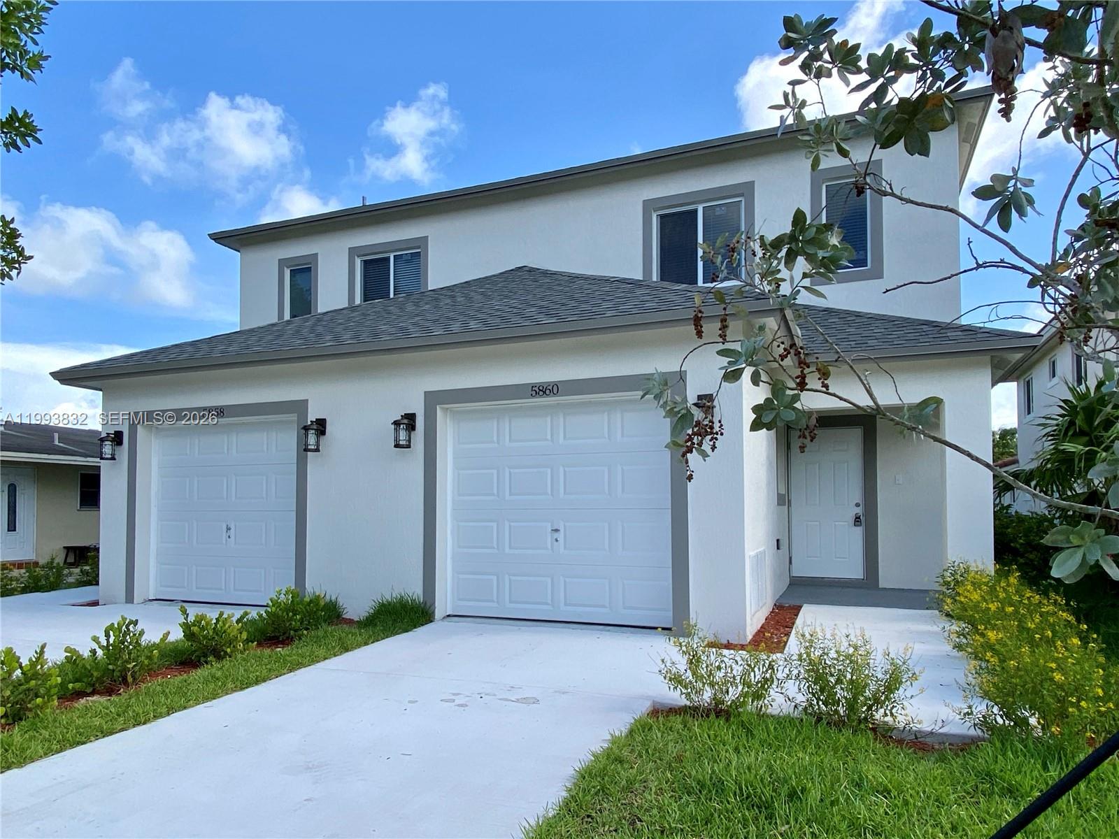 5860 Lincoln Street, Unit 5860 Hollywood, FL 33021 - Photo 3 of 21 a front view of house with yard