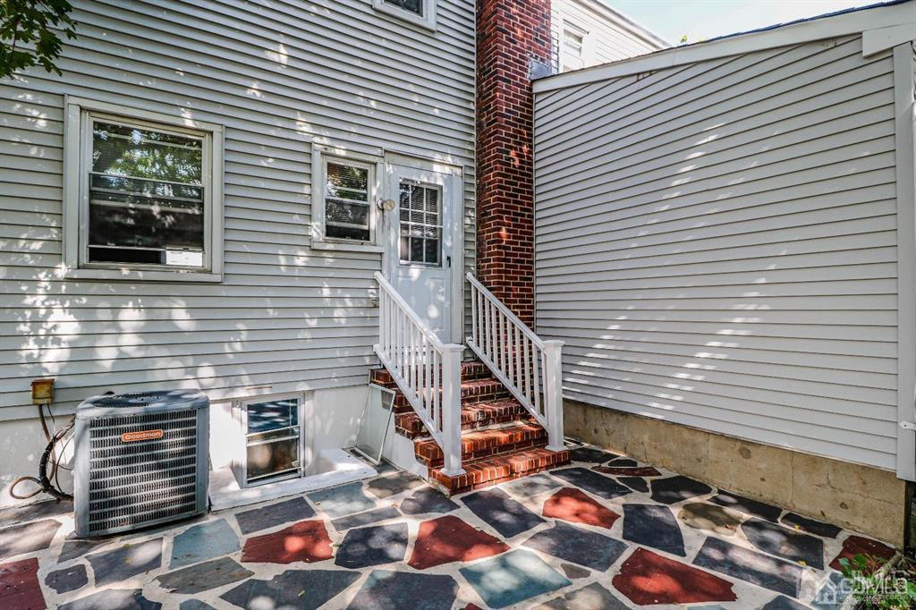 9 MacArthur Drive Edison, NJ 08837 - Photo 11 of 12 a front view of a house with windows and stairs