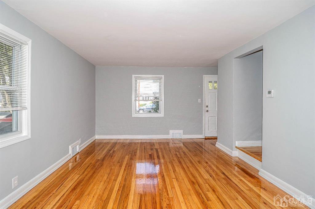 9 MacArthur Drive Edison, NJ 08837 - Photo 3 of 12 a view of a room with wooden floor and window