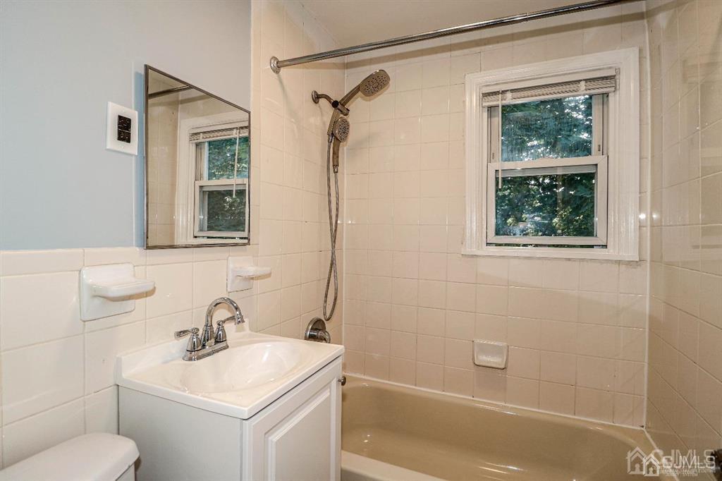 9 MacArthur Drive Edison, NJ 08837 - Photo 8 of 12 a bathroom with a sink toilet and shower