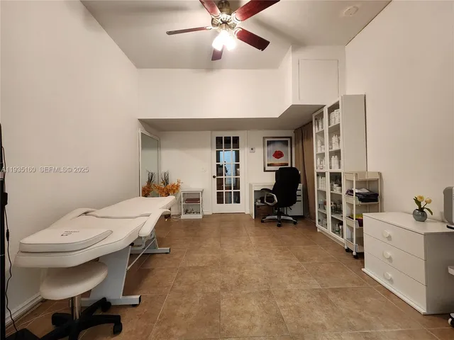 a living room with furniture and white walls