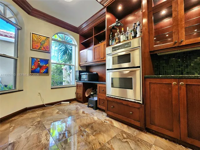 a kitchen with counter top oven