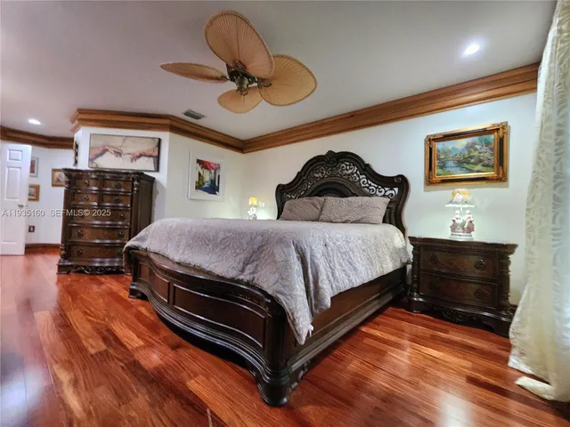 a bedroom with a bed and a black gate