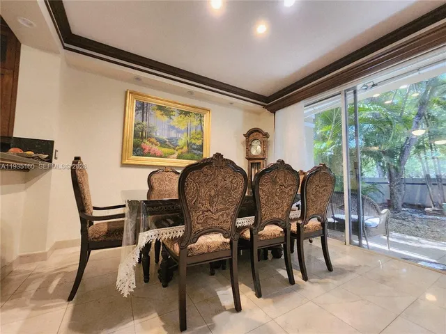 a view of a livingroom with furniture and a flat screen tv