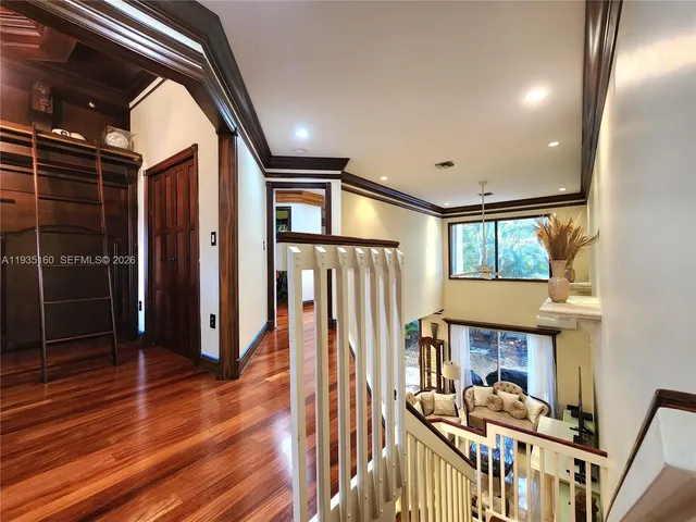 a view of an empty room with stairs