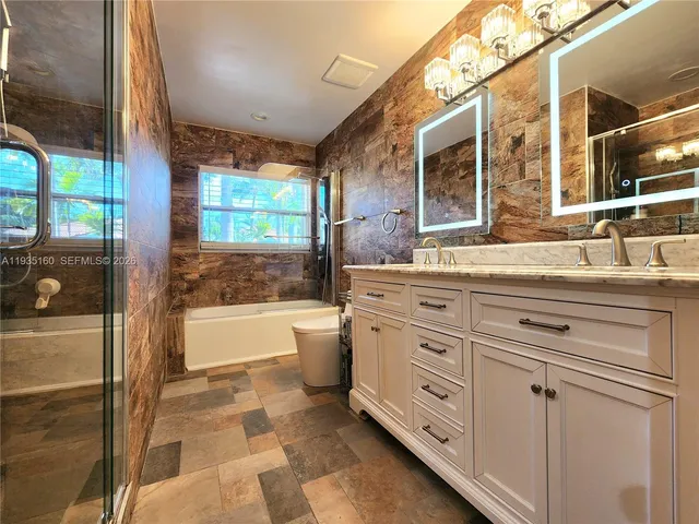 a bedroom with a bed and cabinets