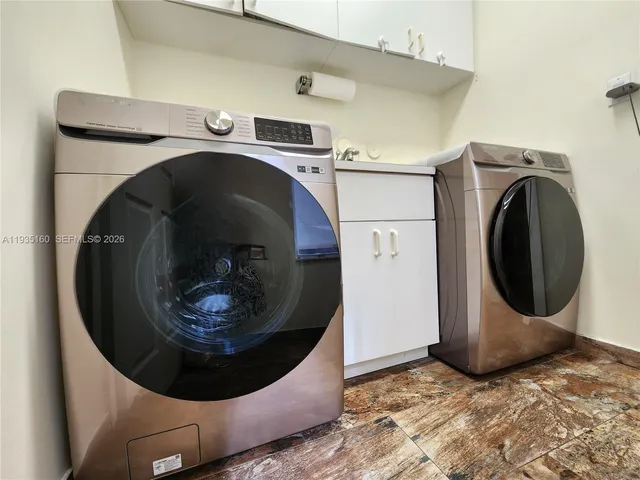a view of a livingroom with workspace and a window