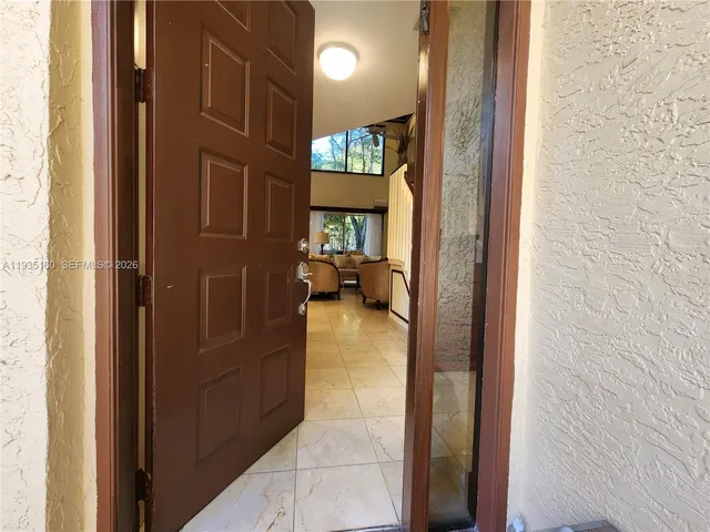 a view of living room with furniture and stairs