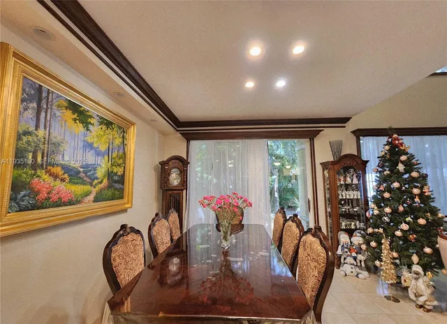 a view of a dining room with furniture wooden floor and window