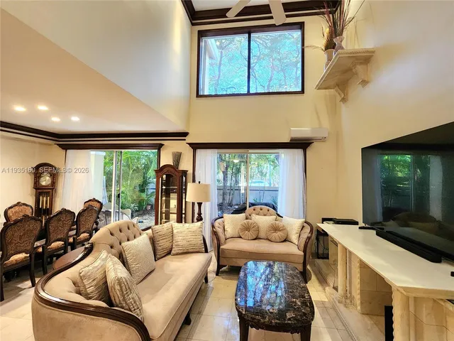 a kitchen with a sink and a large window