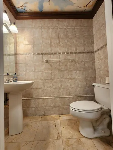 a bathroom with a toilet and a sink