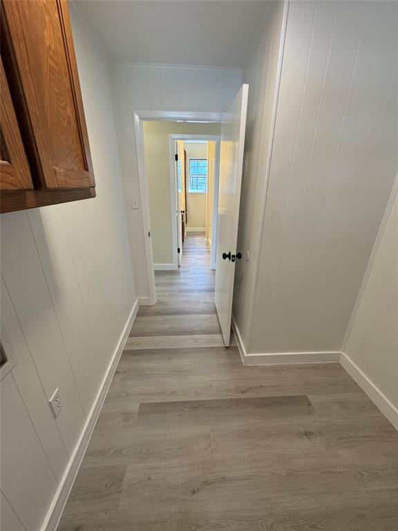 116 Lusk Street Bailey, TX 75452 - Photo 15 of 19 a view of a hallway with wooden floor and staircase