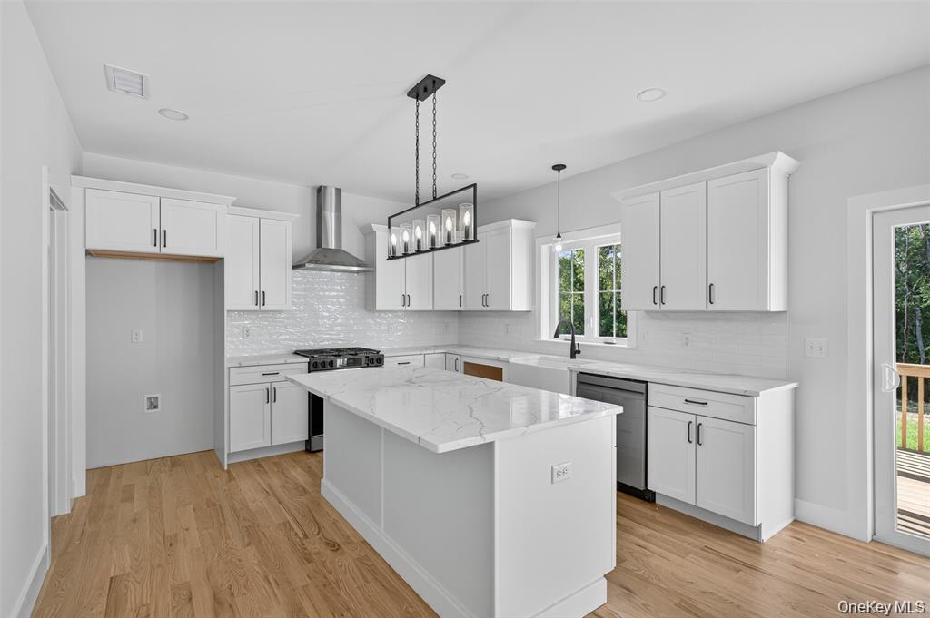 Tbd Kirbytown Road Middletown, NY 10940 - Photo 15 of 35 a kitchen with a stove a sink dishwasher a refrigerator and white cabinets with wooden floor