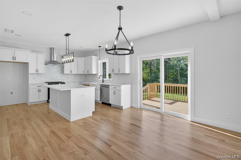 Tbd Kirbytown Road Middletown, NY 10940 - Photo 19 of 35 a kitchen with stainless steel appliances granite countertop a stove a sink dishwasher a refrigerator and white cabinets with wooden floor