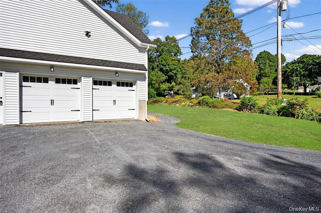 Tbd Kirbytown Road Middletown, NY 10940 - Photo 3 of 35 a front view of a house with a garden and trees