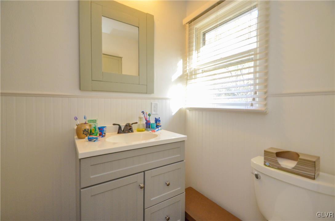 401 Weir Mountain Road Gilbert, PA 18331 - Photo 10 of 23 a bathroom with a sink a vanity and a window