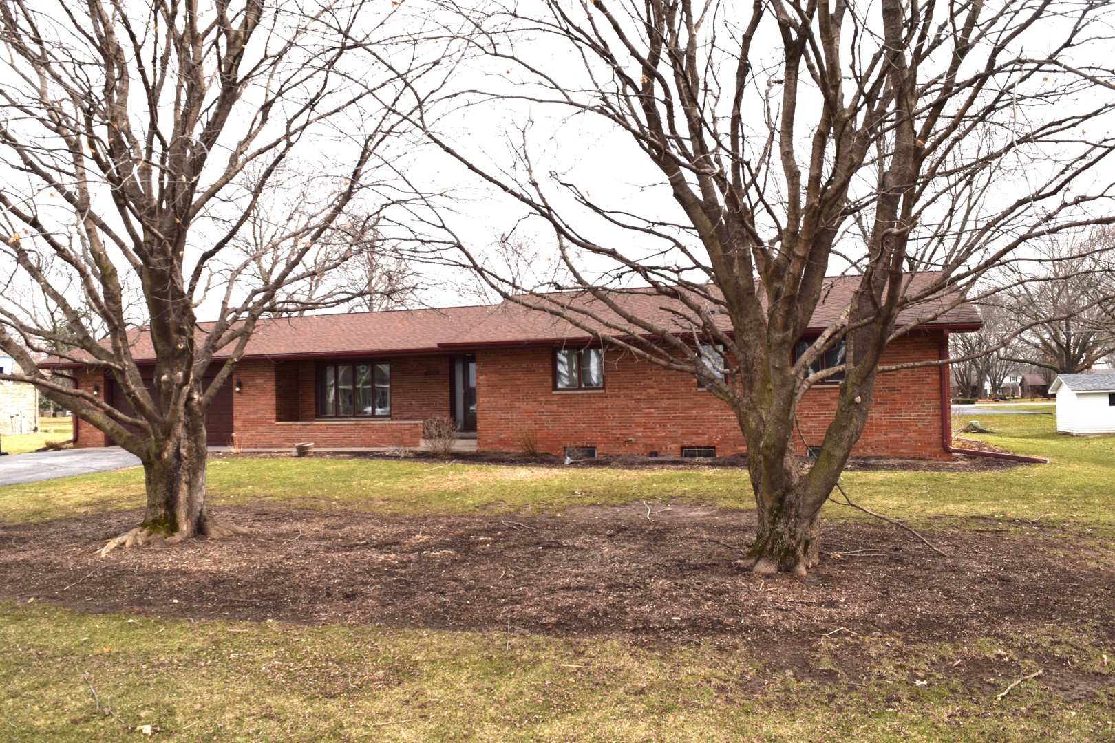 1102 Vale Street Sandwich, IL 60548 - Photo 1 of 1 a view of a yard with a house and a large tree