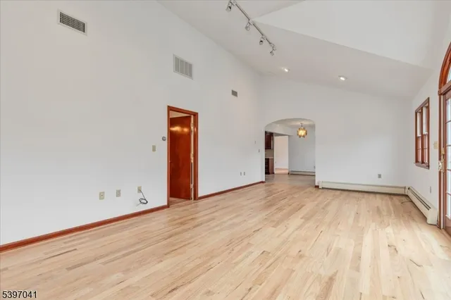 a bathroom with a granite countertop sink a toilet and shower