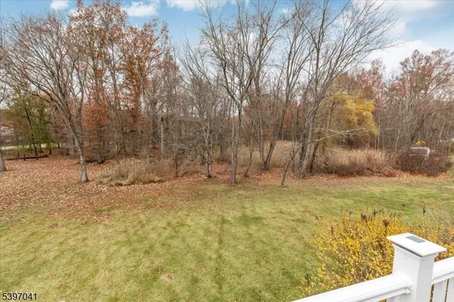 a backyard of apartments with large trees