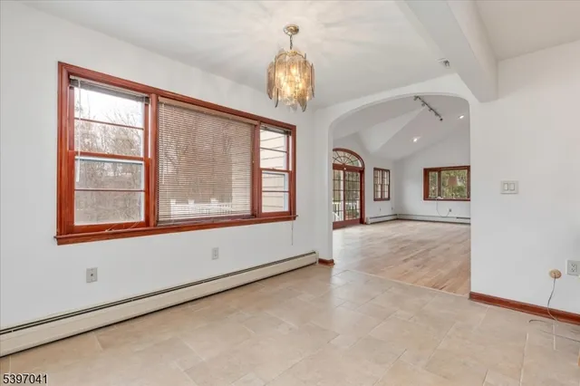 a view of kitchen with refrigerator microwave and cabinets