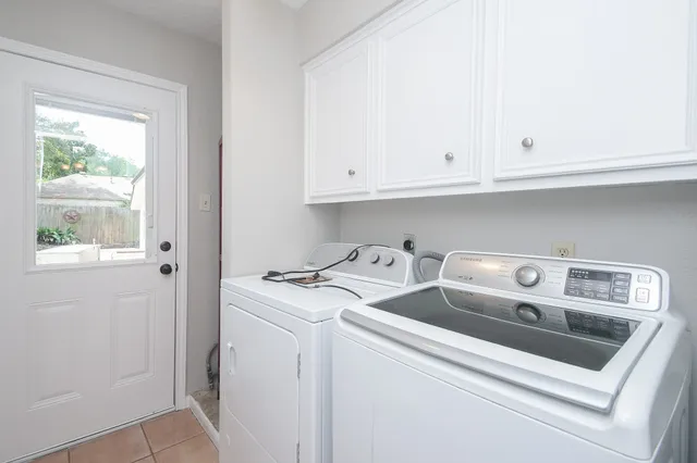 a utility room with dryer and washer