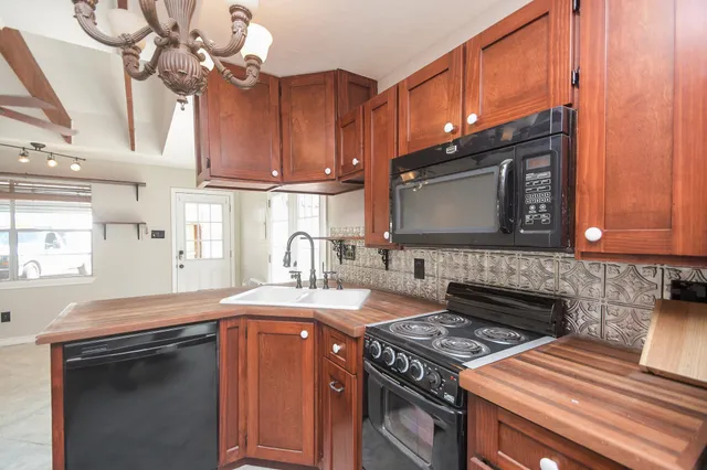 a kitchen with a stove and a microwave