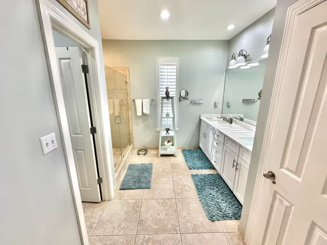 a living room filled with furniture and a chandelier