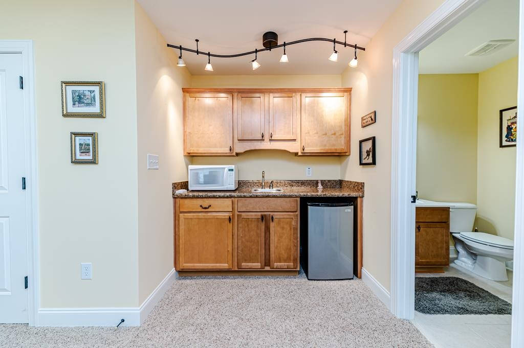 225 Henrys Ridge Road Pittsboro, NC 27312 - Photo 43 of 67 But wait, there's more! Check out the wetbar in the bonus room!