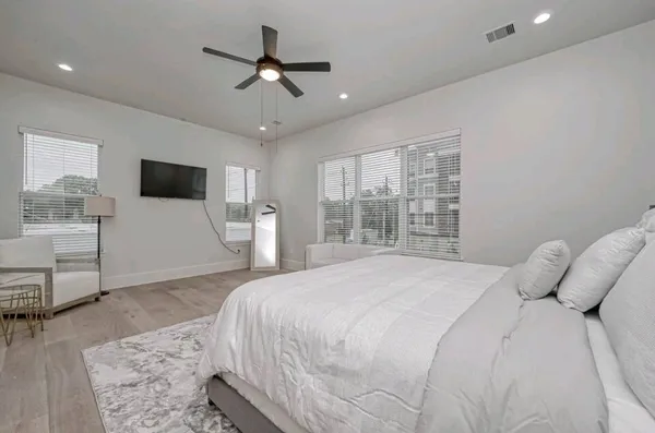 a bathroom with a double vanity sink mirror and shower