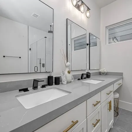 a bathroom with a glass shower door
