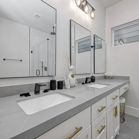 a bathroom with a glass shower door