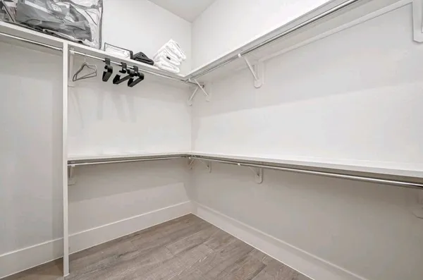 a view of an empty walk in closet