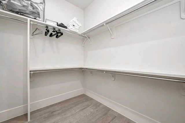 a view of an empty walk in closet