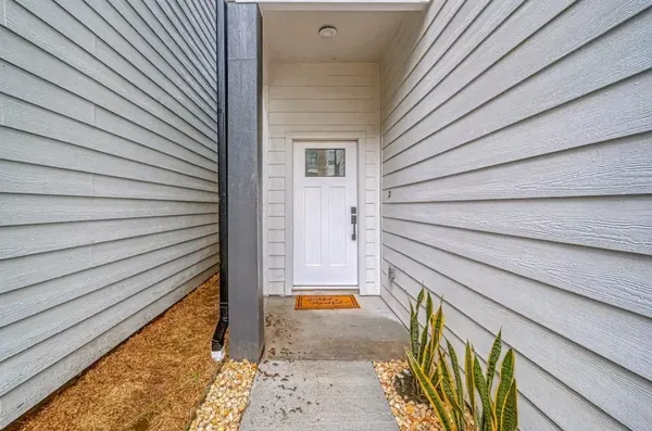 a view of a kitchen with kitchen island a stove a wooden floor