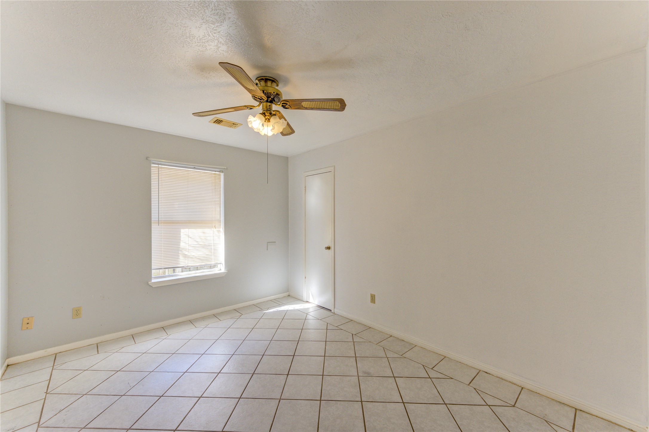 19927 Ricewood Way Katy, TX 77449 - Photo 17 of 23 a view of an empty room and window
