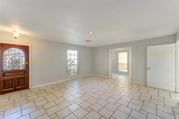 a view of an empty room and window